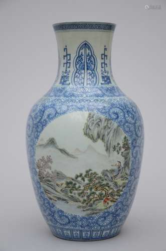 A vase in Chinese famille rose porcelain on a blue and white ground 'sage in a landscape' (*) (