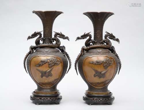 A pair of Japanese bronze vases with relief decoration, Meiji period (signed) (53cm)