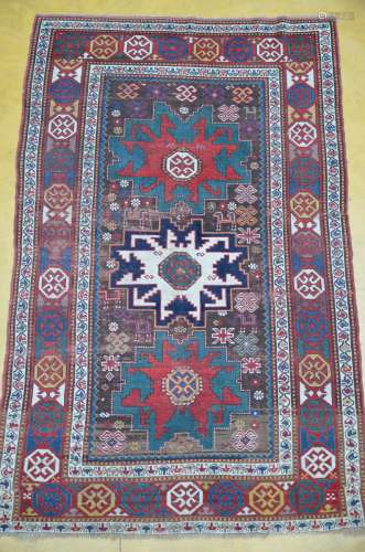 A Caucasian carpet with geometric figures (*) (146x235cm)