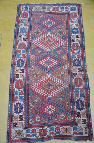 A Caucasian carpet with geometric figures (*) (125x240cm)