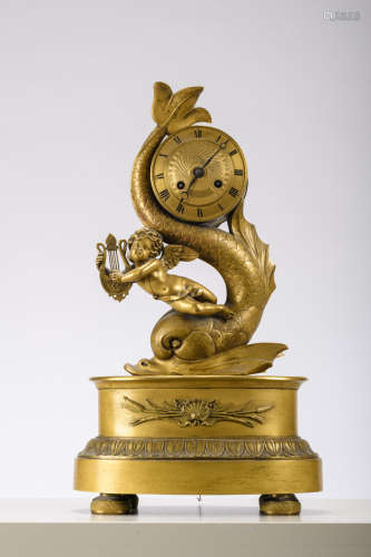 Charles X clock in gilt bronze 'putto with a dolfin' (41cm)