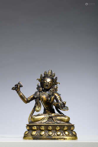 A Sino-Tibetan statue in gilt brons 'Manjushri', 18th century (13cm)