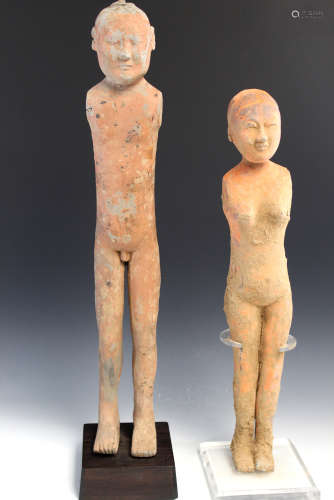 Pair of Chinese grey pottery stick figures, Han Dynasty.
