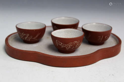 Chinese Yixing pottery tea cups on tray.