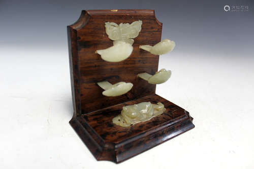 Chinese carved jade on hard wood.