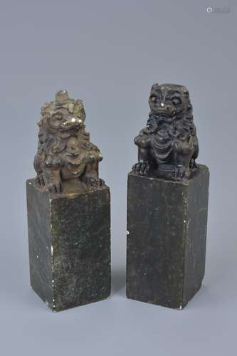 A pair of Chinese carved soapstone seals mounted with lions. Approx. 10.5cm height (2)