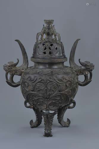 A rare Chinese 'European-style' bronze tripod censer with cover. Elaborately decorated in relief wit