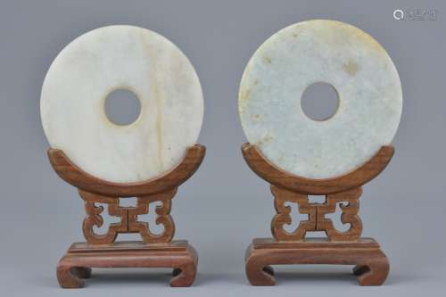 Pair of Chinese Jade Discs on Wooden Stands, 12cms high (2)