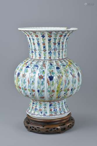 A Chinese doucai porcelain vase with fluted neck bearing six character mark of Qianlong to base on w