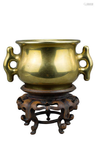 A quality Chinese 18th century polished bronze censer with twin tabbed loop handles and raised six C