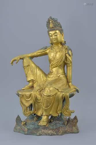 A Chinese gilt bronze figure of Guanyin seated on a separate base with figure of a turtle. Total hei