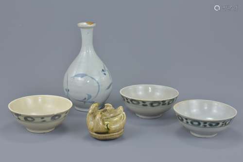 A Japanese blue and white porcelain bottle vase together with three Chinese blue and white porcelain