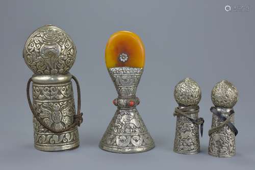 Four Tibetan white metal seals with incensed decoration. 10cm - 17cm tall (4)