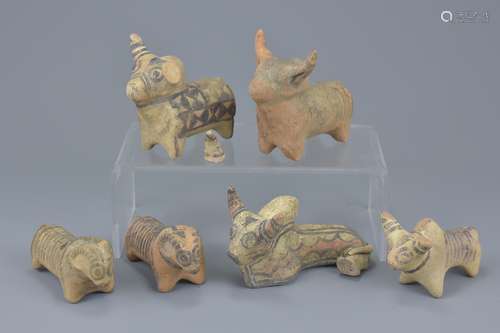 A group of six miniature painted pottery animal figures. Sizes approx. 9cm to 10cm length (6)