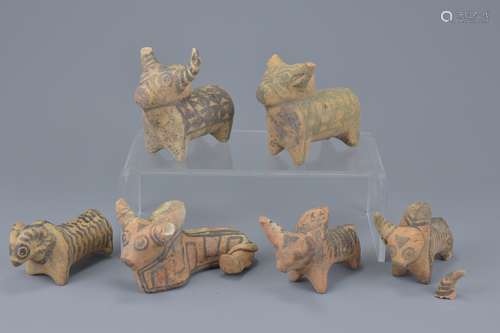 A group of six miniature painted pottery animal figures. Sizes approx. 9cm to 10cm length (6)