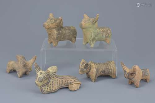 A group of six miniature painted pottery animal figures. Sizes approx. 9cm to 10cm length (6)