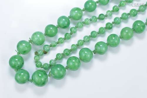 A string of Chinese graduated jadeite beads. 92cm length. Beads 5mm-10mm