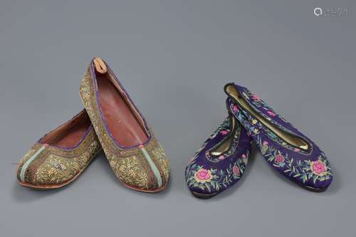 A pair of Chinese early 20th century purple ground embroidered women's shoes with floral decoration