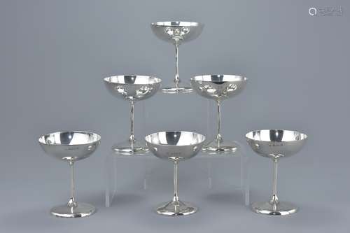 A set of six English Sterling silver champagne flutes Circa 1900. Hallmarked with makers mark W.A Wi