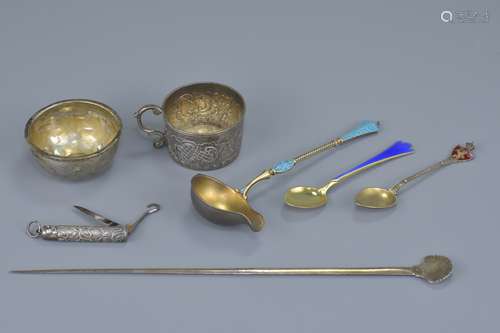 A Russian silver cup with three continental enamelled spoons, a continental punch ladle bowl, a pock