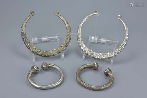 Two Eastern white metal torque / torc necklace together with two smaller white metal bangles. Neckla