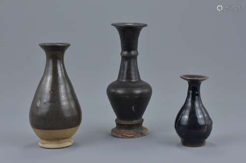 Three Chinese Song / Ming dynasty black glazed pottery vases. 9cm - 16.5cm