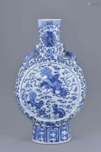 A large Chinese 19th century blue and white porcelain moon flask decorated with foo dogs to each sid