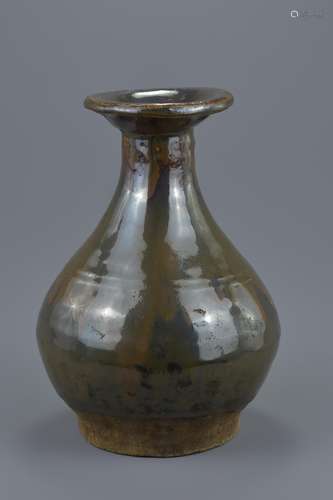 A Chinese Ming dynasty Cizhou ware brown glazed pear-shaped pottery wine bottle. 23.5cm tall