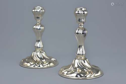 A pair of German anlaufgeschützt Sterling silver 925 marked candle sticks. 15cm tall