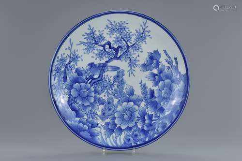 A very large 19th century Japanese blue and white porcelain dish with bird and floral decoration. 47