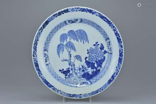 A large 18th century Chinese blue and white porcelain dish decorated with willow tree. 35cm diameter