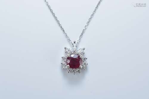 An 18ct white gold necklace stamped 750 with multi diamond and ruby pendant. Ruby size approx. 6mm x