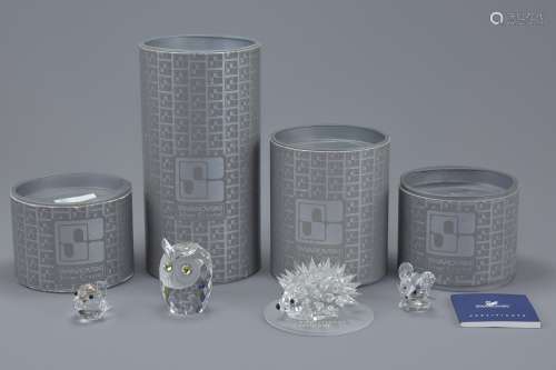 A group of four Swarovski crystal animal figurines to include a bird, an owl, a hedgehog (M.Schrek,