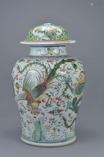 A large Chinese 17th century famille verte dragon and phoenix jar with later cover. Total 38cm tall