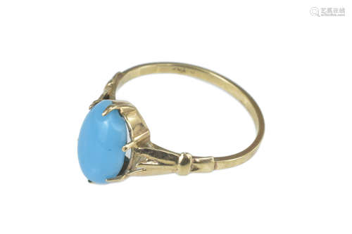 A 9ct gold ring with light blue cabochon. Ring size M