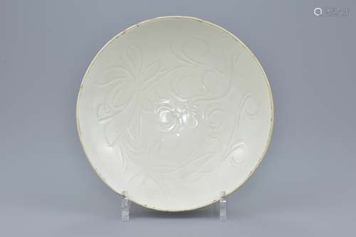 Chinese Dingyao Porcelain Bowl with Incised Lotus Pattern. Coated in a clear creamy-coloured glaze,