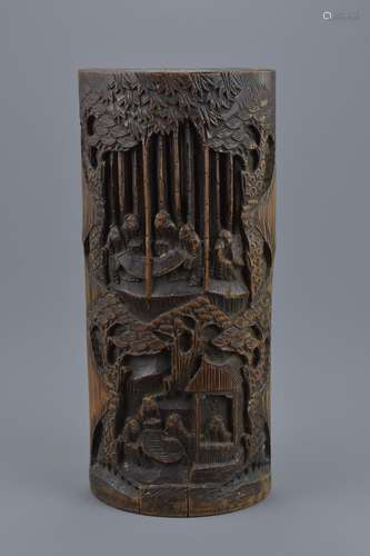 A Chinese 19/20th century carved bamboo brush pot. Carved with figures. 30.5cm height