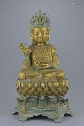 A large Chinese gilt bronze figure of Guanyin seated in padmasana on separate lotus bronze stand 53c