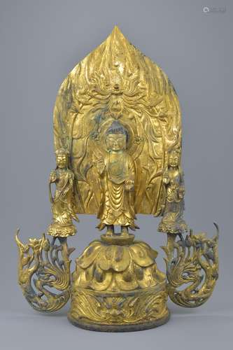 A large Chinese gilt bronze shrine of Buddha and two followers in four separate detachable pieces. 4