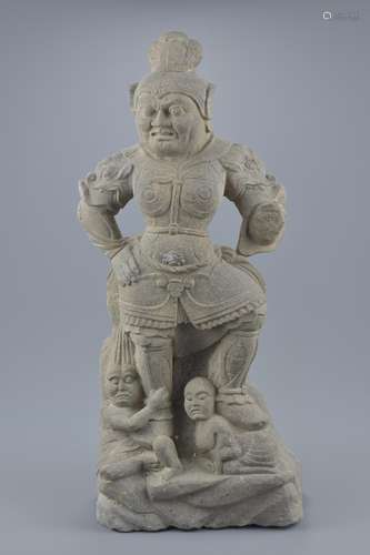 A Chinese Tang style grey stone carving of a tomb guardian. 45cm tall. Weight 10.950kg