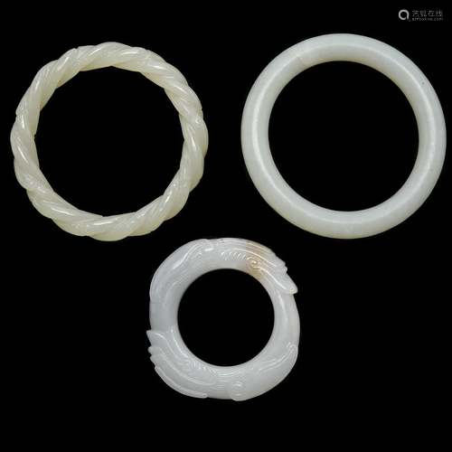 Three Chinese Carved Jade Bangle Bracelets.