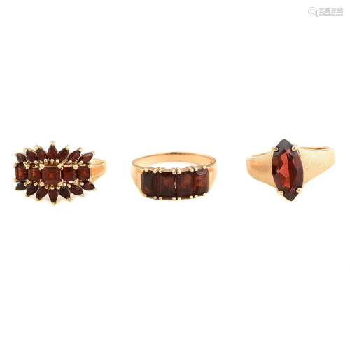 Collection of Three Garnet, Yellow Gold Rings.