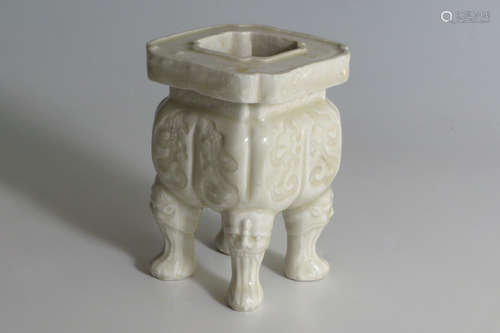 FOUR-LEGGED RECTANGULAR BURNER WITH INCISED FLOWERS AND ANIMAL FACE, WHITE GLAZE, YUAN DYNASTY