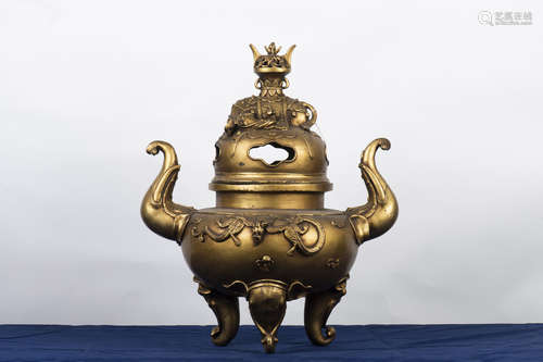 PARCEL GILT BRONZE CAST LARGE TRIPOD CENSER WITH ELEPHANT MASK HANDLES AND LID