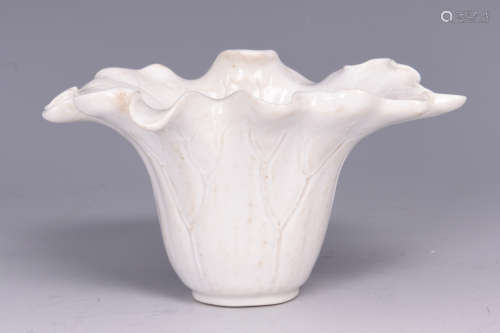 WHITE GLAZED FLORIFORM AND INCISED CUP