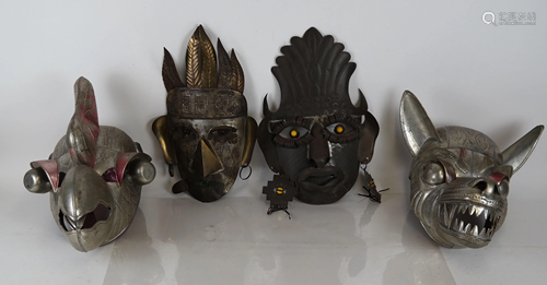 Four Tin Tribal Masks