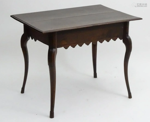 A 19thC continental walnut table with a rectangu…