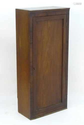 An early 20thC mahogany cupboard with a …