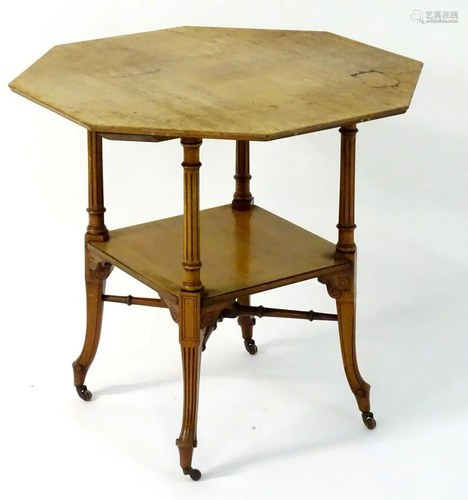 A late 19thC walnut octagonal table with fluted