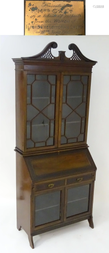 An early 20thC mahogany bureau bookcase …